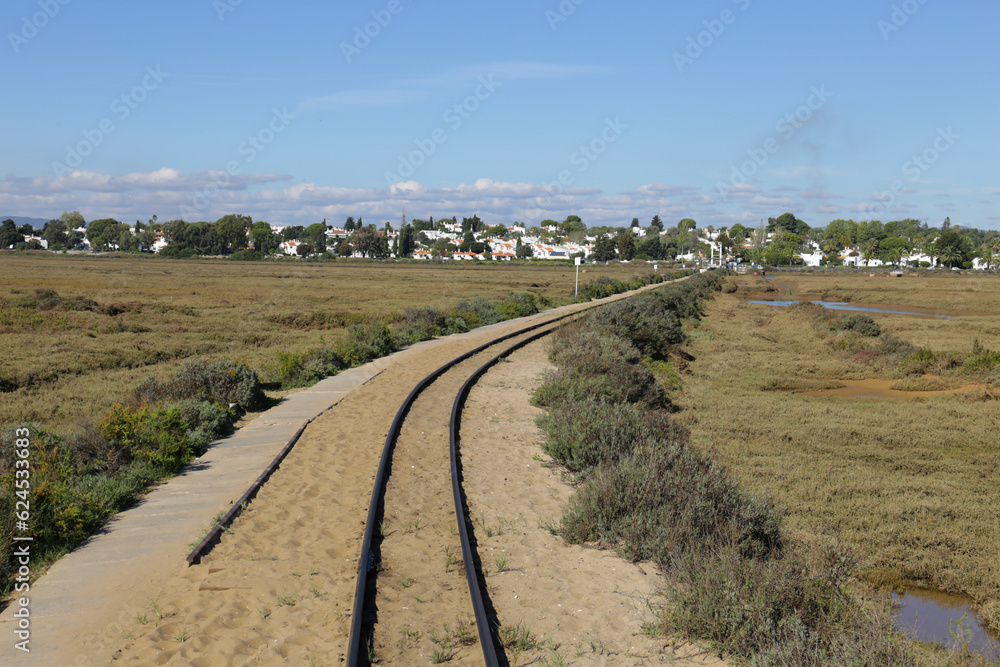 Train tracks of the touristic train to Praia do Barril Beach in Tavira