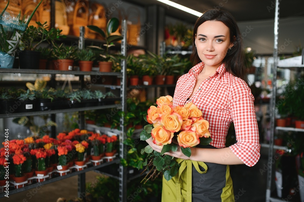 Portrait of female florist in her flower shop.