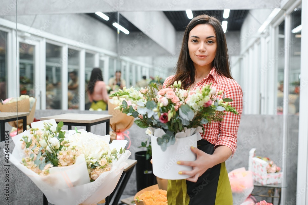 Portrait of female florist in her flower shop.