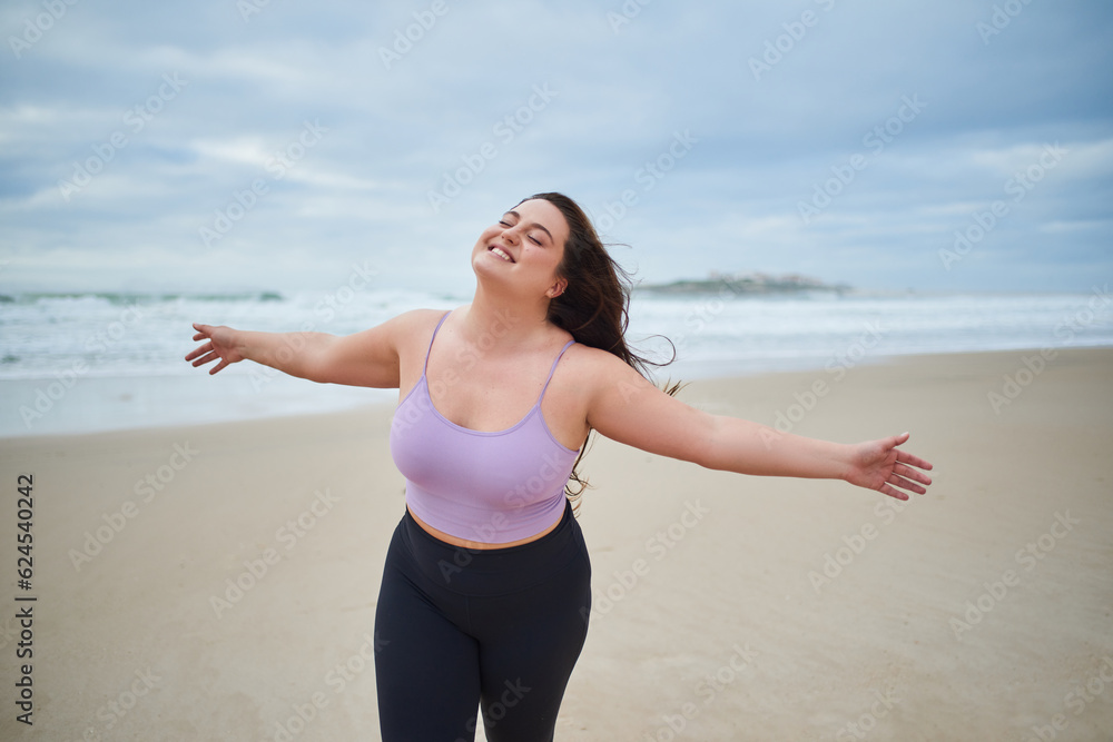 Happy pleasant woman spread her arms and enjoying sea breeze Happy pleasant woman spread her arms and enjoying sea breeze