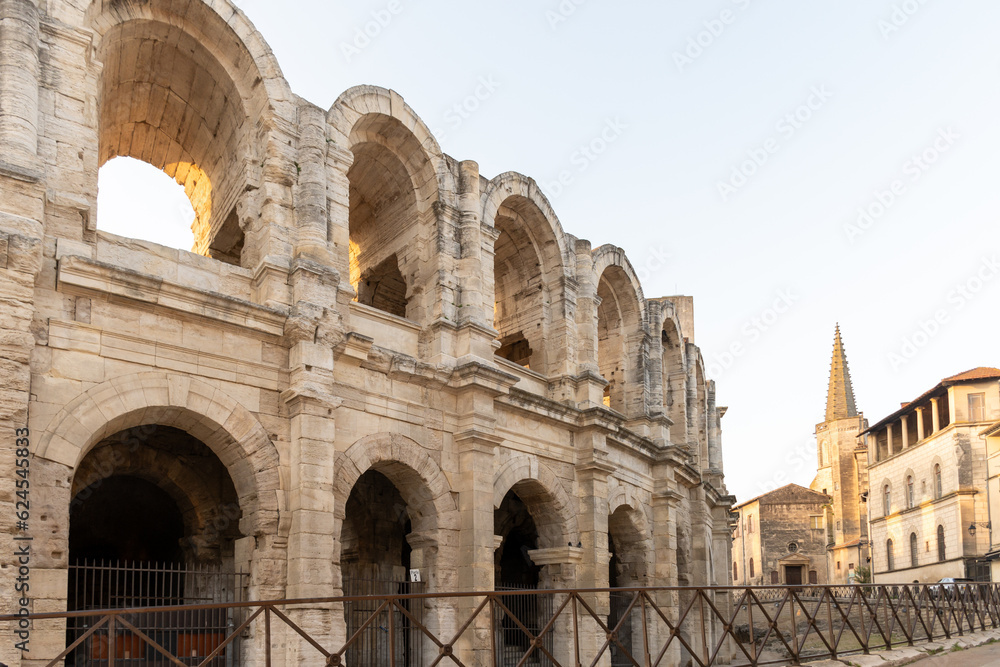 View on streets and Roman Arena in ancient french town Arles, touristic destination with Roman ruines, Bouches-du-Rhone