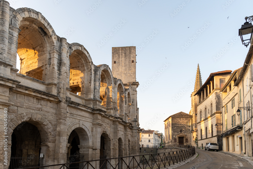 View on streets and Roman Arena in ancient french town Arles, touristic destination with Roman ruines, Bouches-du-Rhone