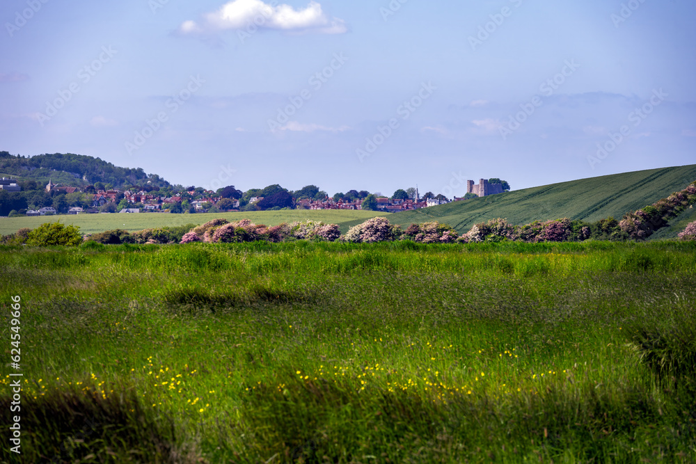View of the countryside around Rodmell, East Sussex, England, in spring, with Lewes castle in the background