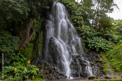 Waterfall in the Botanical Garden of Ribeira do Guilherme in Nordeste with tourists, Sao Miguel island in the Azores. © Vitor Miranda
