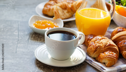 Continental breakfast with fresh croissants, orange juice and coffee, selective focuse. photo