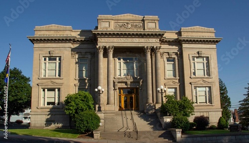 The Dalles, Oregon, USA - 24 June, 2023: Wasco County Courthouse Front View Head on with Blue Sky photo