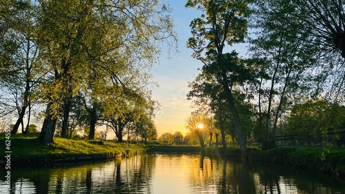 Bild auf Leinwand sunset over the river