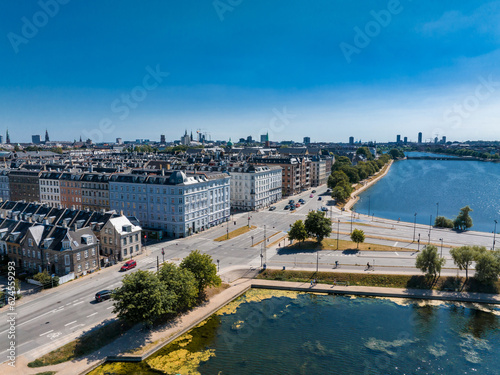 Aerial view of the Copenhagen in Denmark. Central historical part of the city, city roofs and Copenhagen lakes.