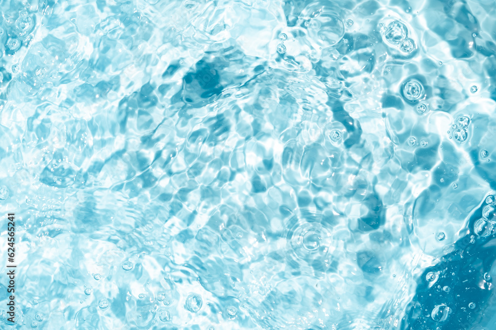 Closeup Transparent blue clear water surface texture with ripples. Abstract​ of​ surface​ blue​ splashes and bubbles​ water waves  reflected​ with​ sunlight​ for