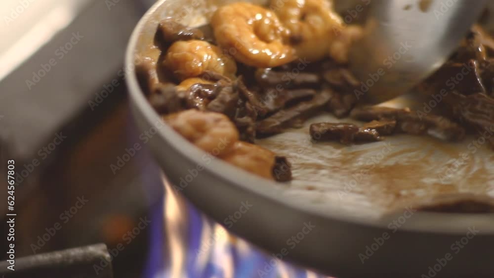 stirring prawns and mushrooms in pan with spoon, sea food, delicious, Slow motion stirring prawns and mushrooms in pan with spoon, sea food, delicious, Slow motion