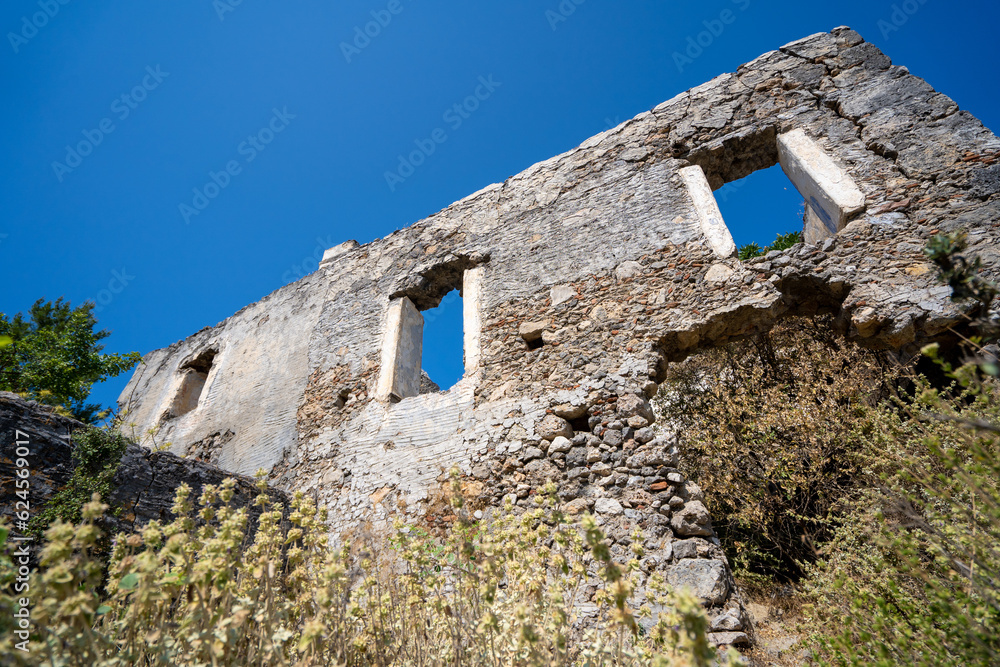Windows of old abandoned house in ghost town Kayakoy. Kayakoy is abandoned Greek village in Fethiye district, Turkey.