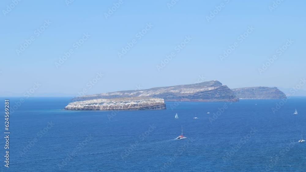 Blue Ocean and Aspronisi Island at the Caldera of Santorini Blue Ocean and Aspronisi Island at the Caldera of Santorini