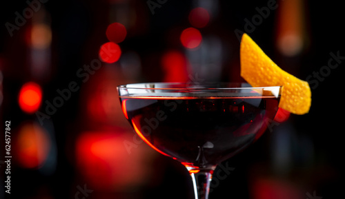 Photography Adonis alcoholic cocktail drink with sherry and red vermouth, black bar counter