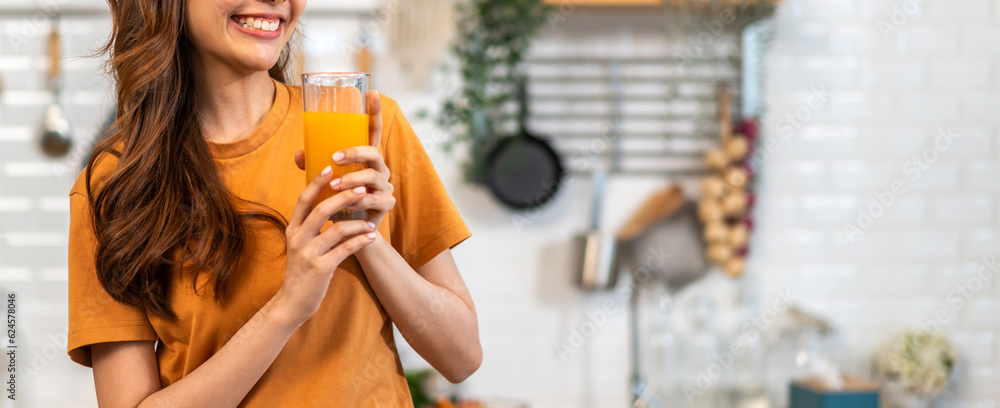 Portrait of beauty body slim healthy asian woman drinking glass of juice and orange.young girl preparing healthy drink with fresh orange juice, vitamin c, in kitchen at home.Diet.healthy drink Portrait of beauty body slim healthy asian woman drinking glass of juice and orange.young girl preparing healthy drink with fresh orange juice, vitamin c, in kitchen at home.Diet.healthy drink