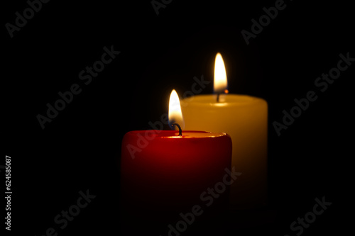 Candle flame in the darkness, hope and memory