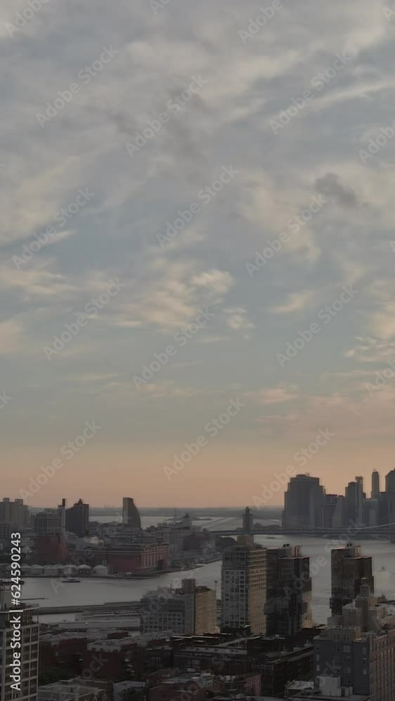 As sun sets over t East River Williamsburg Bridge showcases stunning panoramic view from Brooklyn. As sun sets over t East River Williamsburg Bridge showcases stunning panoramic view from Brooklyn.