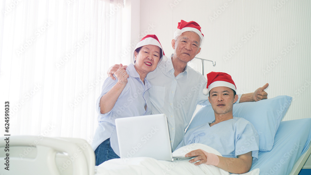 Asian family celebrating Christmas and New Year in hospital kid admit recovery good family relationship Asian family celebrating Christmas and New Year in hospital kid admit recovery good family relationship