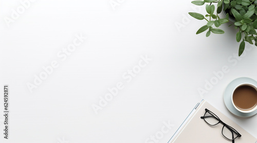White office desk with plant, glasses, and notebook. Top view with copy space. Flat lay