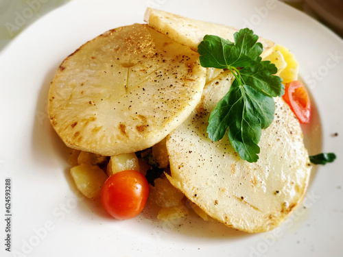 Kohlrabi schnitzel with vegetables German style vegetarian dish with fried turnips