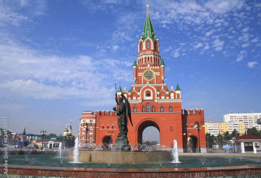 Yoshkar-Ola, Republic of Mari El, Russia - 08.20.2021. The Annunciation Tower and the Archangel Gabriel Fountain Monument Yoshkar-Ola, Republic of Mari El, Russia - 08.20.2021. The Annunciation Tower and the Archangel Gabriel Fountain Monument