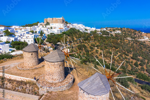 Obraz na płótnie The three windmills of Chora and iconic Monastery of Saint John the Theologian in chora of Patmos island, Dodecanese, Greece w salonie