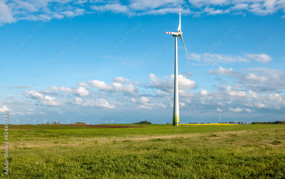 Wind turbine on grassy field Wind turbine on grassy field