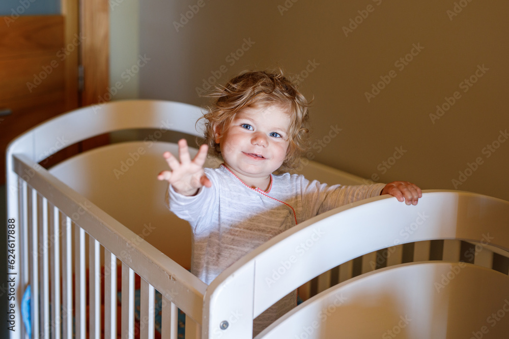 Cute Little Baby Girl Lying in Cot after Sleeping. Healthy Happy Child