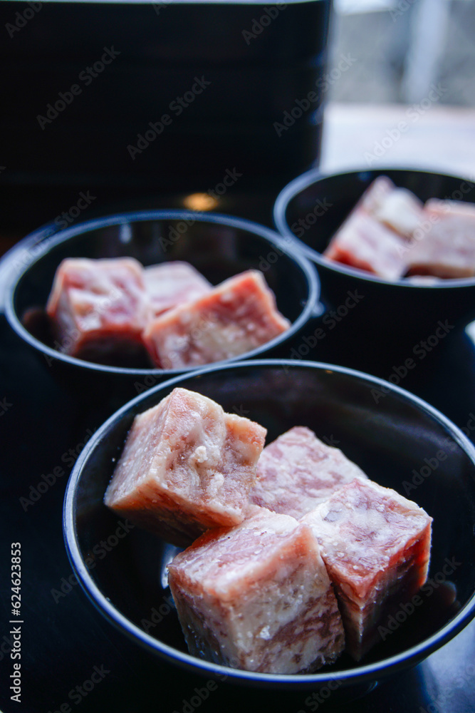 Cubes of raw beef meat in bowl