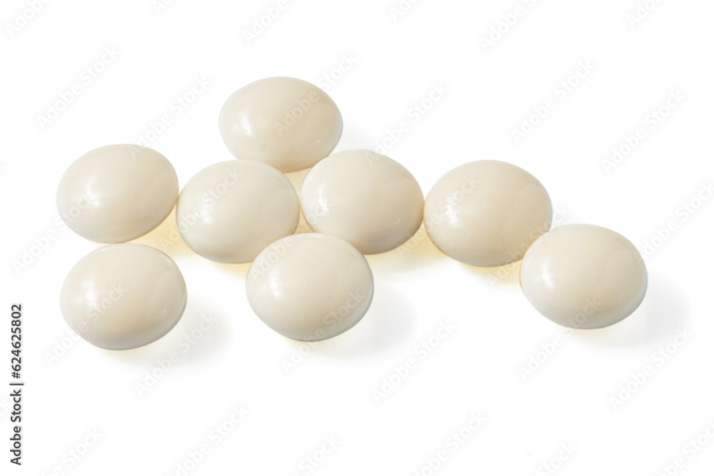 Top view of Many Circle-shaped white pills isolated on a white background. Top view of Many Circle-shaped white pills isolated on a white background.