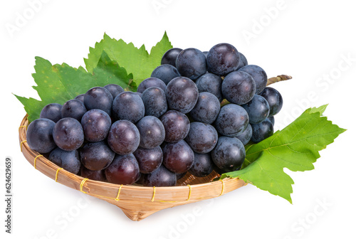 Organic black grapes in Bamboo basket, Fresh Kyoho Grape isolate on white background with clipping path.