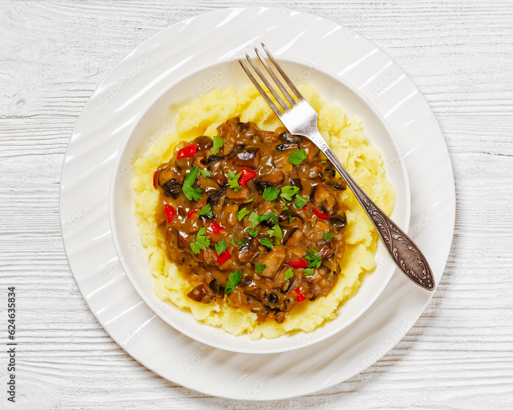 potato mash topped with mushroom gravy in bowl potato mash topped with mushroom gravy in bowl