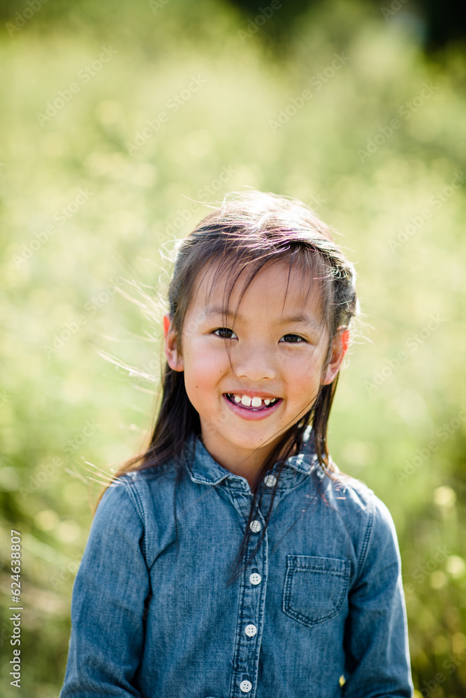 Portrait of Seven Year Old Asian Girl in Field in San Diego Portrait of Seven Year Old Asian Girl in Field in San Diego