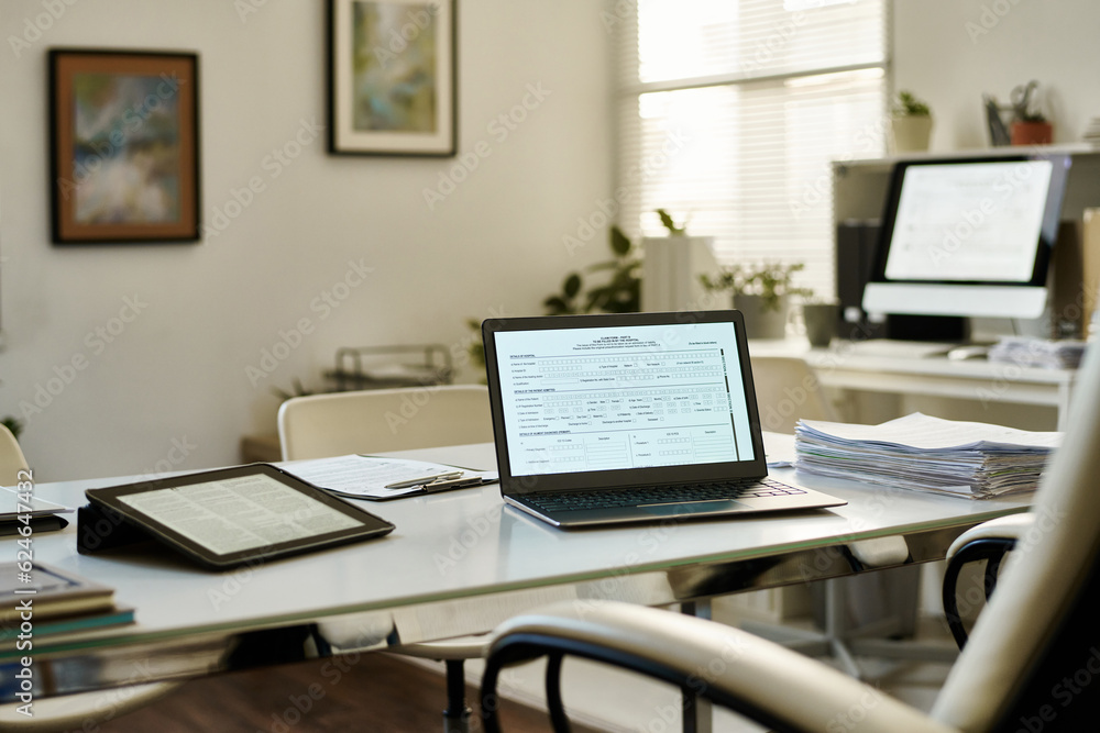 Modern workplace of manager with laptop on table in office Modern workplace of manager with laptop on table in office
