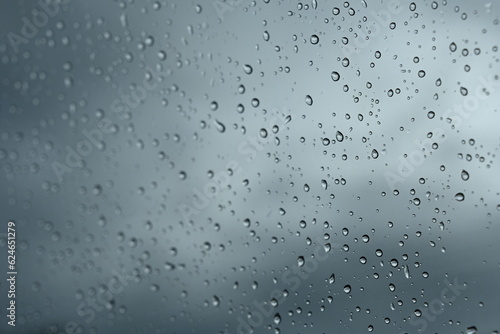 raindrops drops on car glass sky background