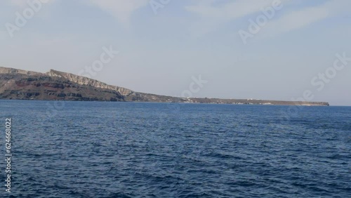 View of Thirassia island from Ammoudi Bay, Santorini photo