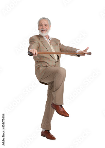 Cheerful senior man with walking cane on white background