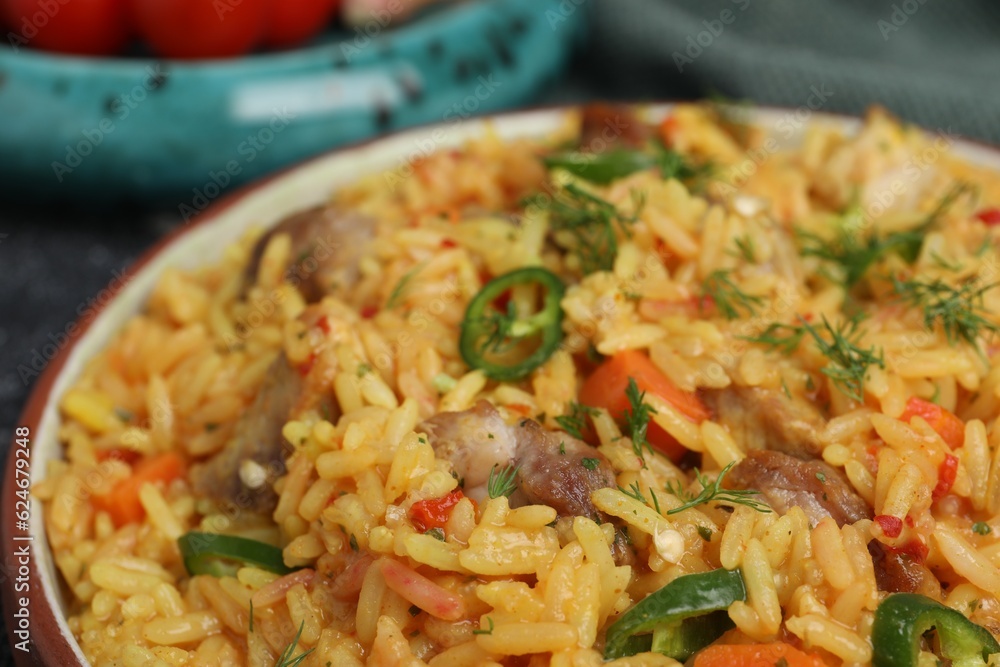 Delicious pilaf with meat on plate, closeup Delicious pilaf with meat on plate, closeup