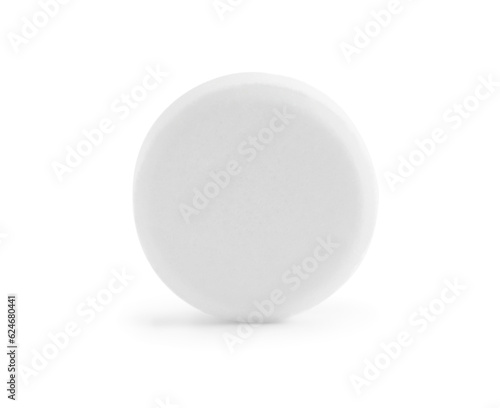 One round pill on white background. Medicinal treatment
