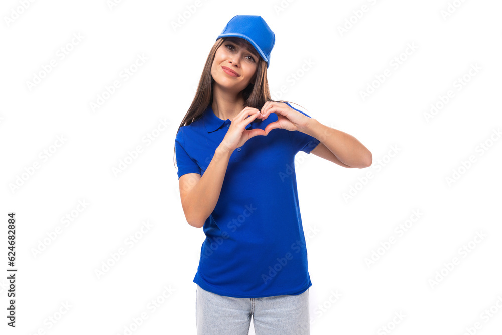 charming young caucasian brunette woman in uniform t-shirt and cap with space for brand print charming young caucasian brunette woman in uniform t-shirt and cap with space for brand print