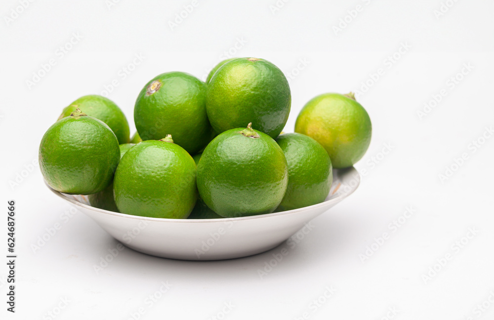 fresh lemons on plate on a white background fresh lemons on plate on a white background