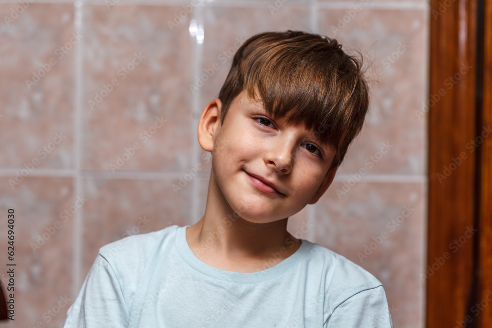 nine year old boy looks at the camera and smiles. close-up portrait nine year old boy looks at the camera and smiles. close-up portrait