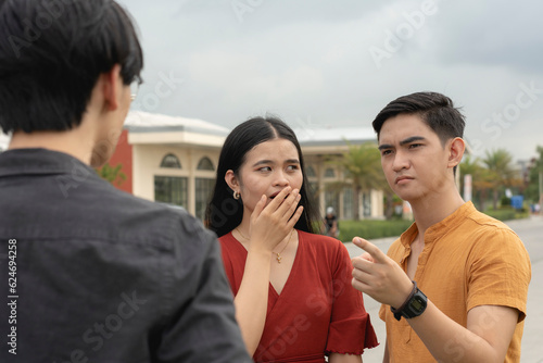 An irate man warns his girlfriend's ex-partner to stay away, much to her shock. An awkward meeting between two rivals for the same woman. photo