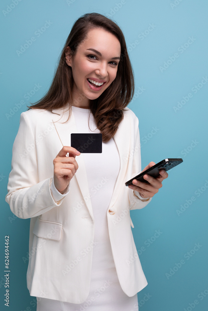 energetic brunette woman in office dress with shopping card energetic brunette woman in office dress with shopping card