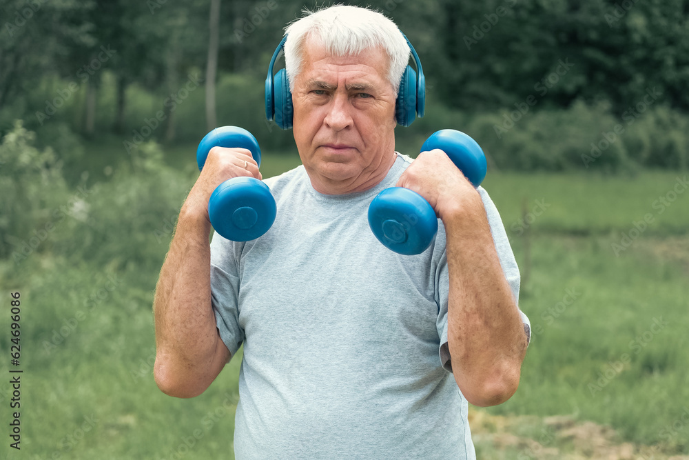 Senior man working out outdoors. Person lifting dumbbells. Old male exercising at park. Healthy people lifestyle. Active sport training. Older elderly sportsman doing fitness exercise. Workout session Senior man working out outdoors. Person lifting dumbbells. Old male exercising at park. Healthy people lifestyle. Active sport training. Older elderly sportsman doing fitness exercise. Workout session