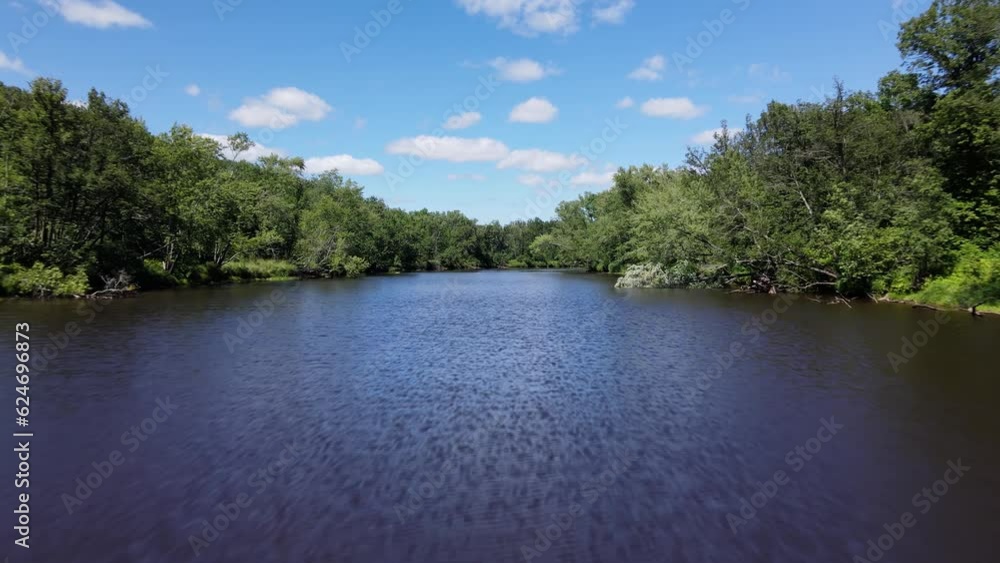 Flying over a river surrounded by forest in Minnesota. Flying over a river surrounded by forest in Minnesota.