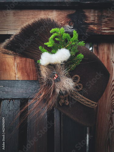 a traditional hunting hat with chamois hair, a spruce twig and cotton flowers after the hunt