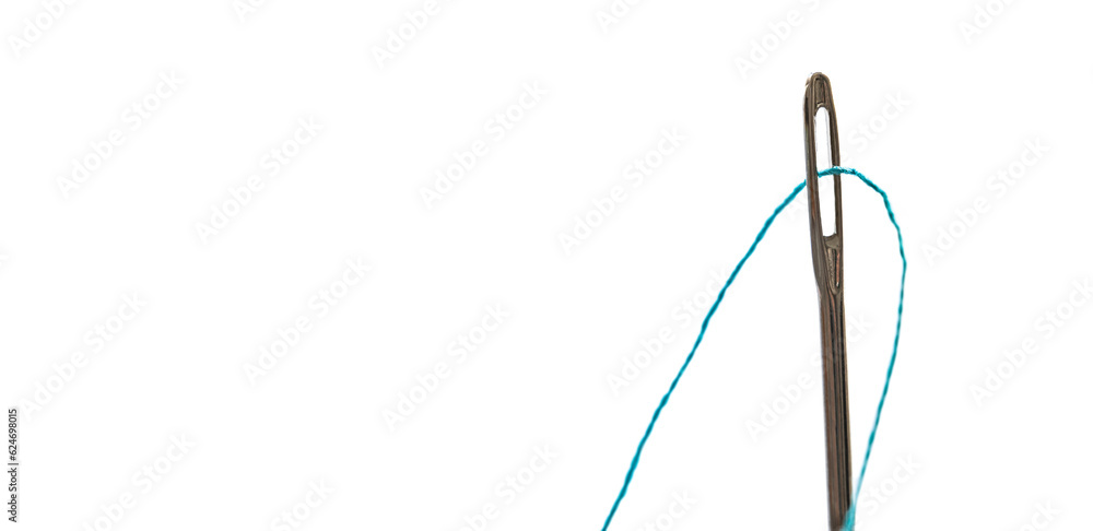 Steel needle with blue threat isolated on white background with copy space closeup. Fabric tool for cloth sew and fix macro view Steel needle with blue threat isolated on white background with copy space closeup. Fabric tool for cloth sew and fix macro view