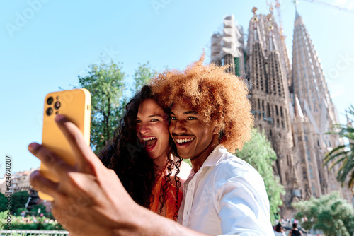 Photography young multiethnic couple of tourists taking selfie in Barcelona, Spain