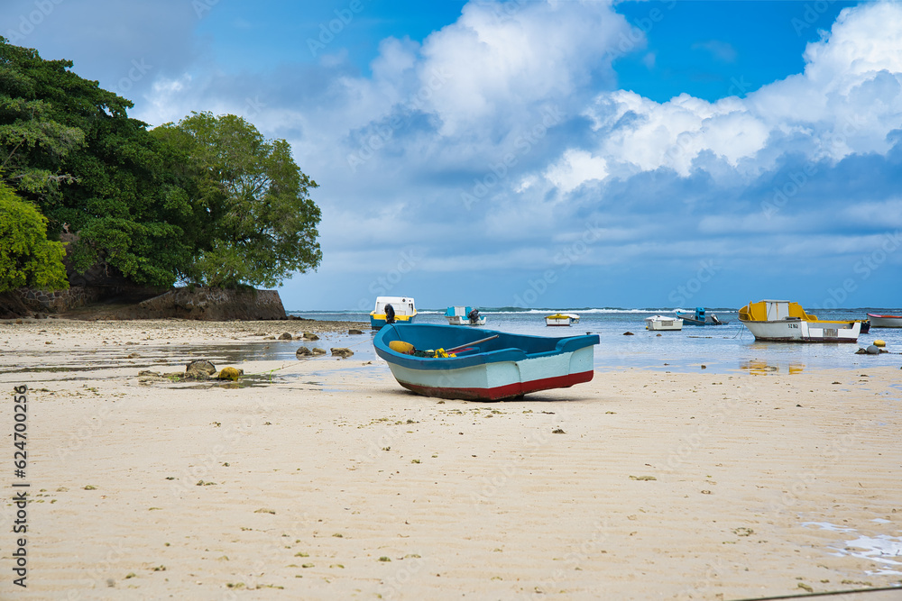 Docking fisherman boats on sand during low todes, white sandy beach, Mahe Seychelles Docking fisherman boats on sand during low todes, white sandy beach, Mahe Seychelles