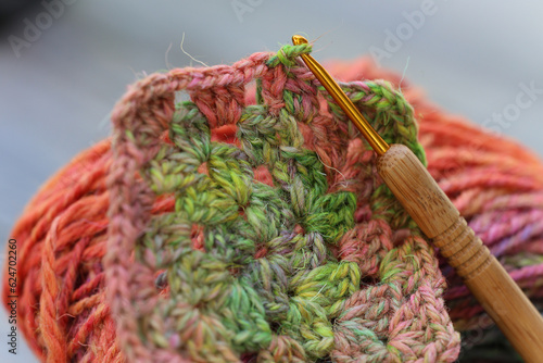 Fotografie Closeup detail of crochet work with a colourful skein of organic natural handspu